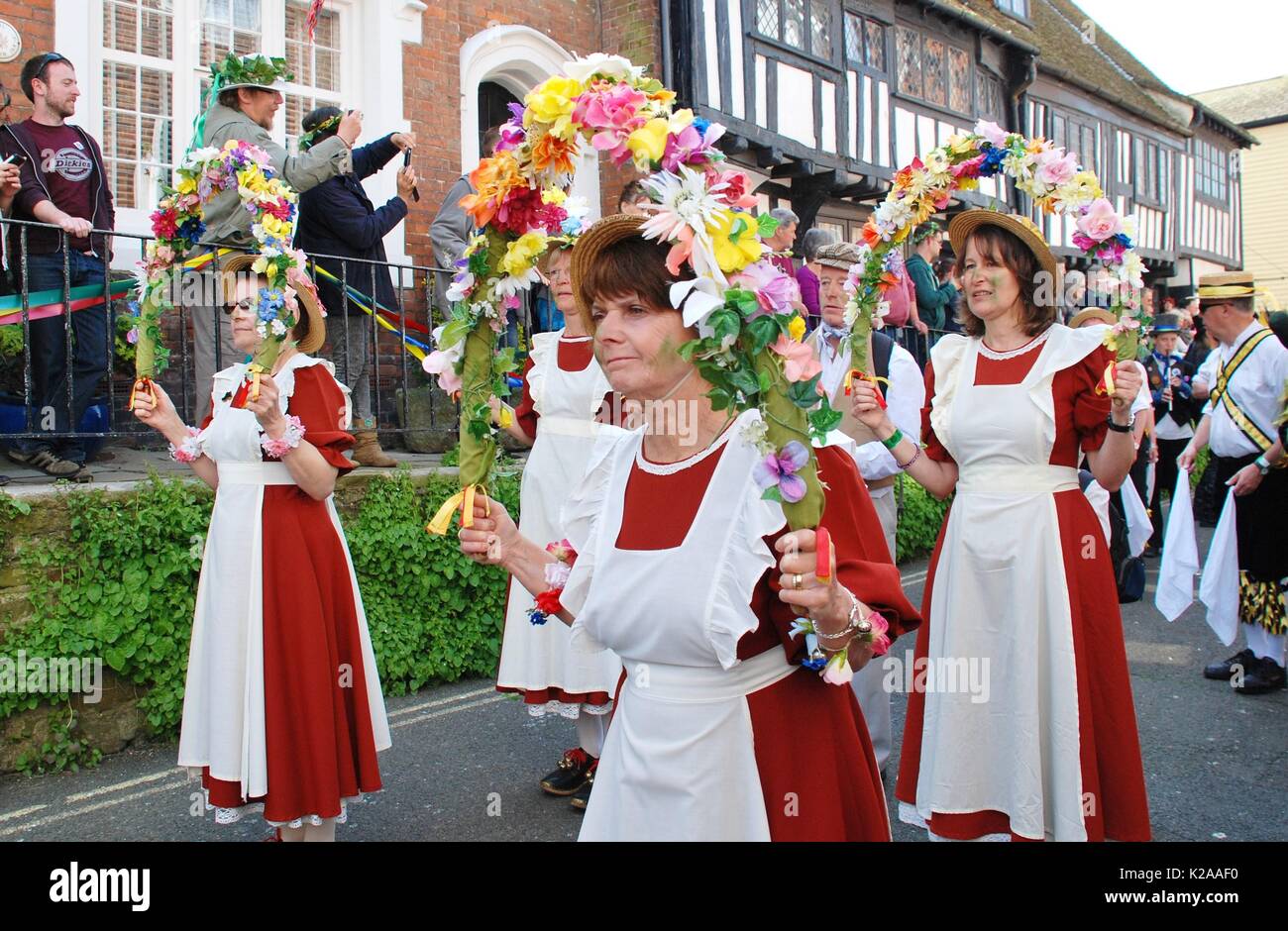 Copperfield Clog morris dancers perform during the parade through the Old Town at the Jack In The Green festival in Hastings, England on May 5, 2014. Stock Photo