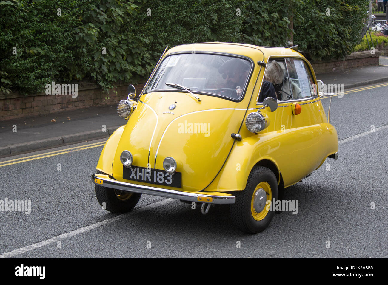 BMW yellow Isetta standard bubble car at the 2017 Ormskirk MotorFest on Sunday 27 August. 300 vintage, 1950s bubble car microcar. Microcars classic cars from all eras of motoring lined up on town centre streets and in Coronation Park for people to admire. Stock Photo