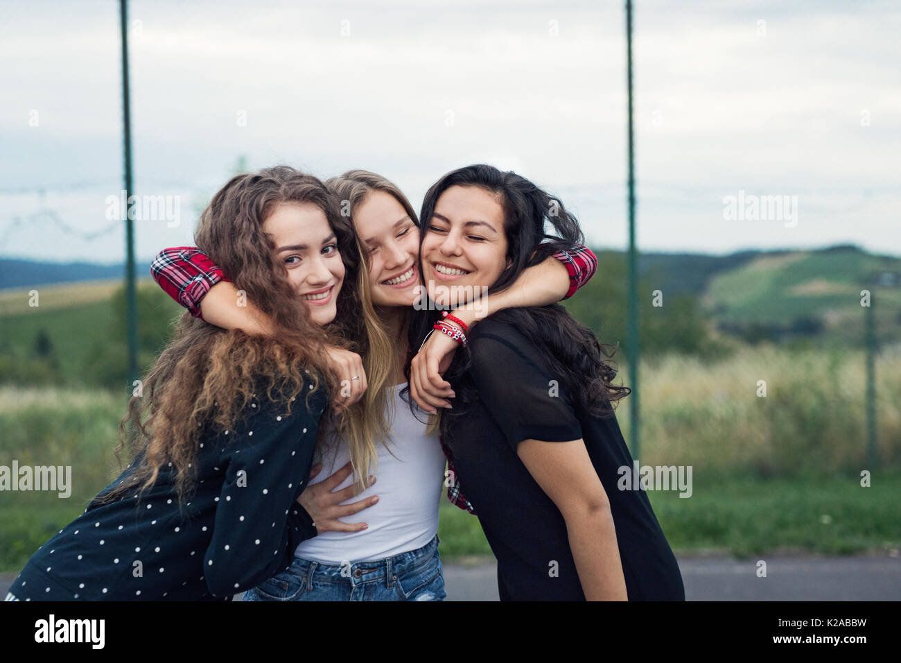 Teenage friends girls hugging hi-res stock photography and images - Alamy