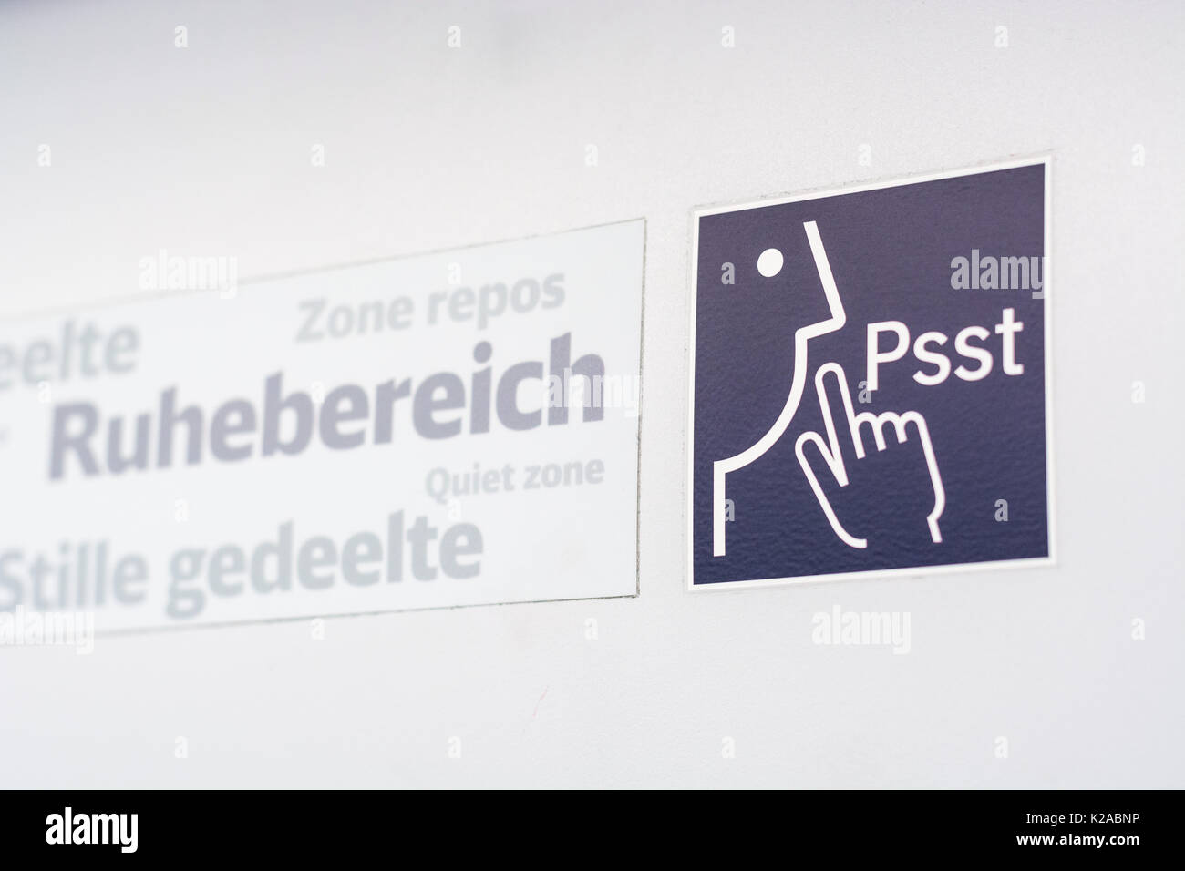 A sign and a symbol for "Quiet Zone" in a train isolated Stock Photo