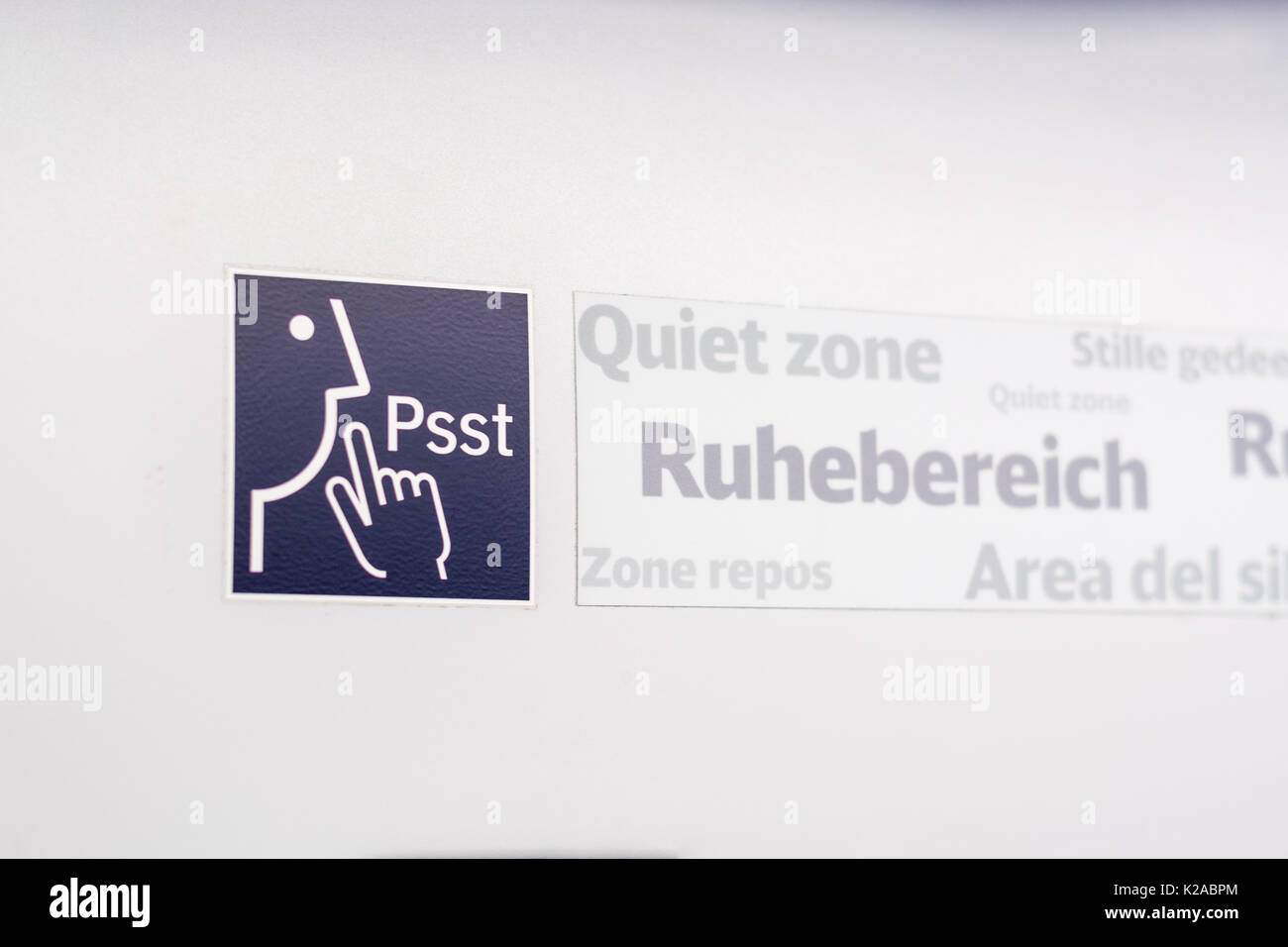 A sign and a symbol for "Quiet Zone" in a train isolated Stock Photo