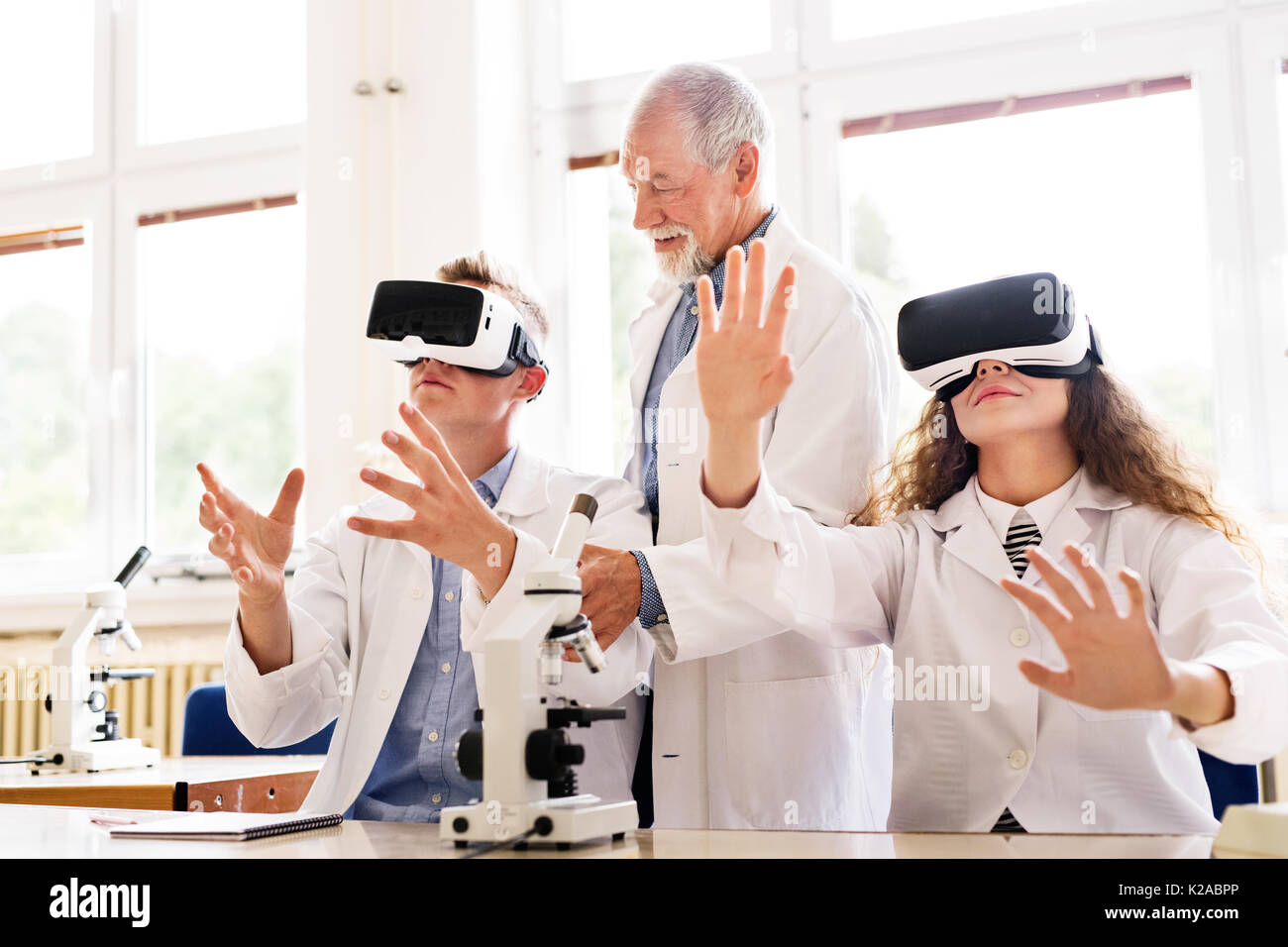 Senior teacher teaching biology to high school students Stock Photo