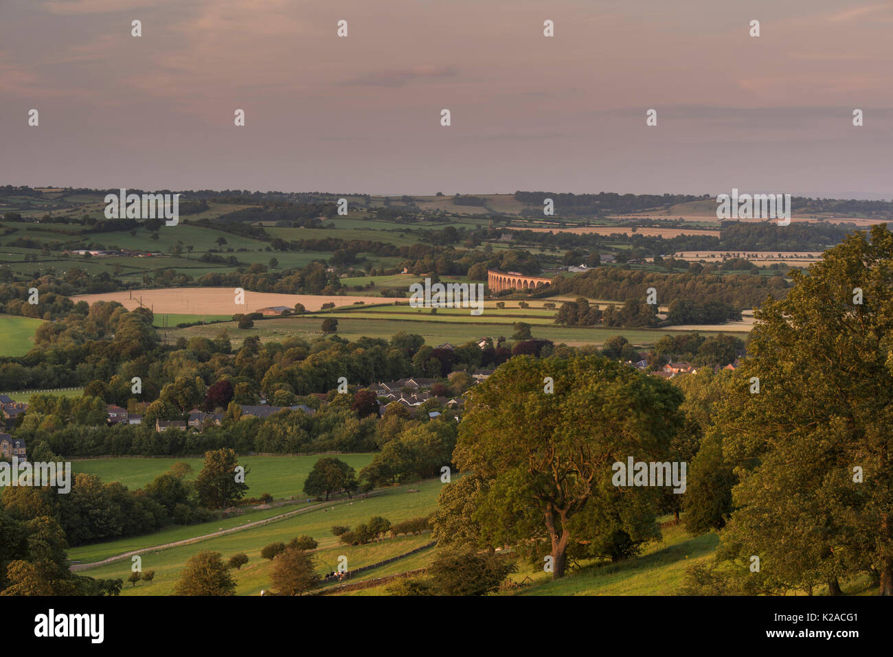 Sunset high view over sunlit Wharfe Valley, with Pool in Wharfedale village & Arthington viaduct in a scenic rural landscape - Yorkshire, England, UK. Stock Photo