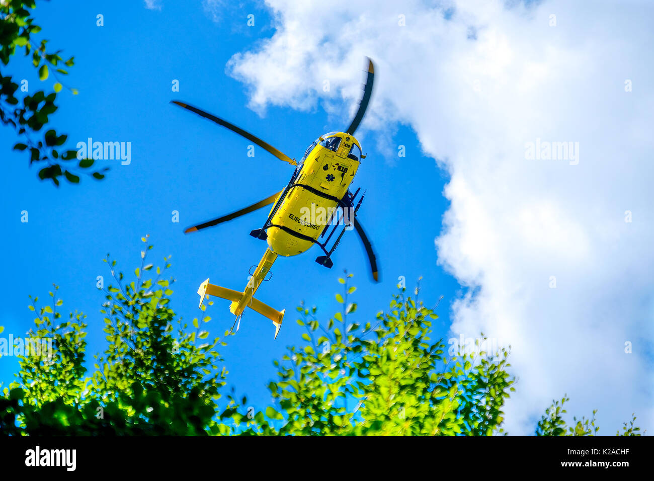 Modena, 27 Aug 2017:  an italian Elisoccorso ( helicopter rescue medical service ) yellow helicopter used for mountain rescue Stock Photo