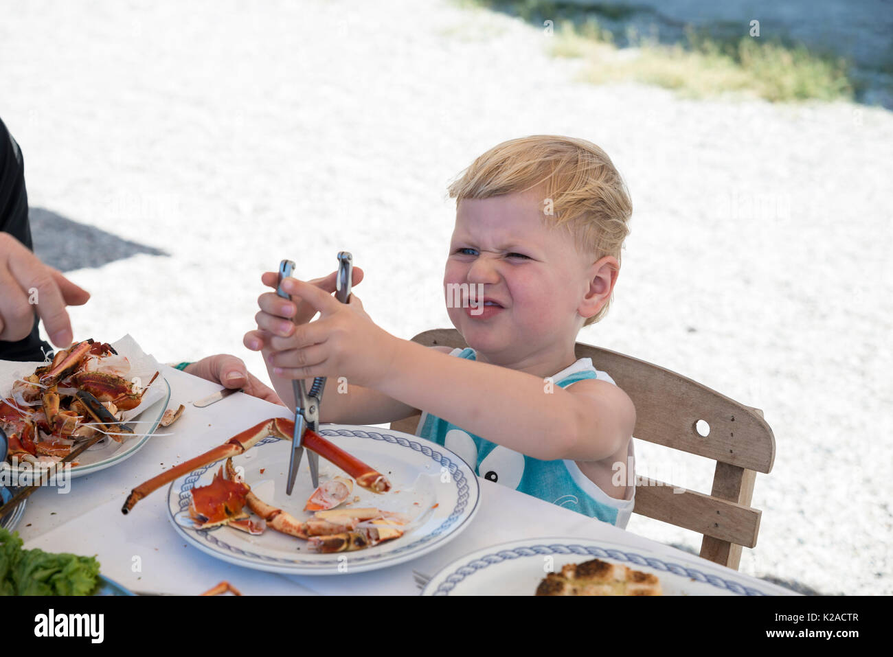 Threeyearold boy eating lobster, "Old Kamiros" restaurant, Kameiros