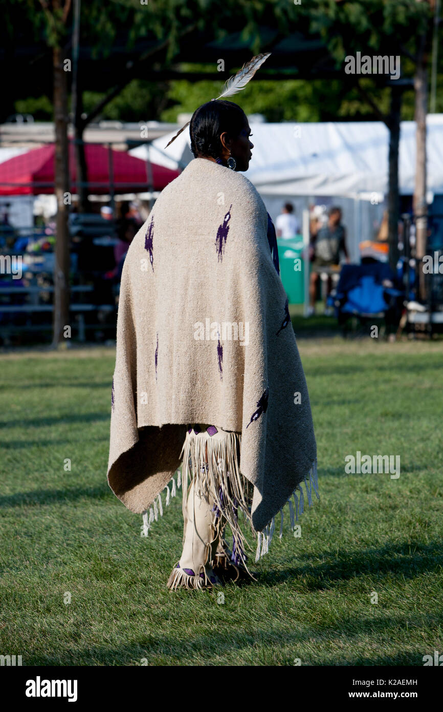 A Native American woman waits for the start of the Eastern Blanket Dance  competition Stock Photo - Alamy