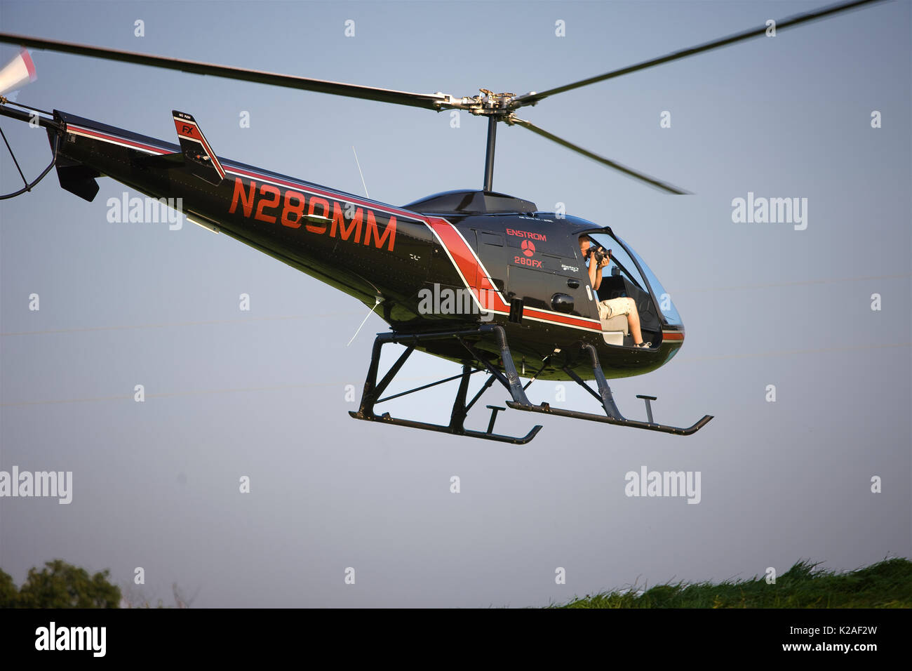 HELICOPTER TAKING OFF TO PERFORM AERIAL PHOTOGRAPHY, LANCASTER PENNSYLVANIA Stock Photo