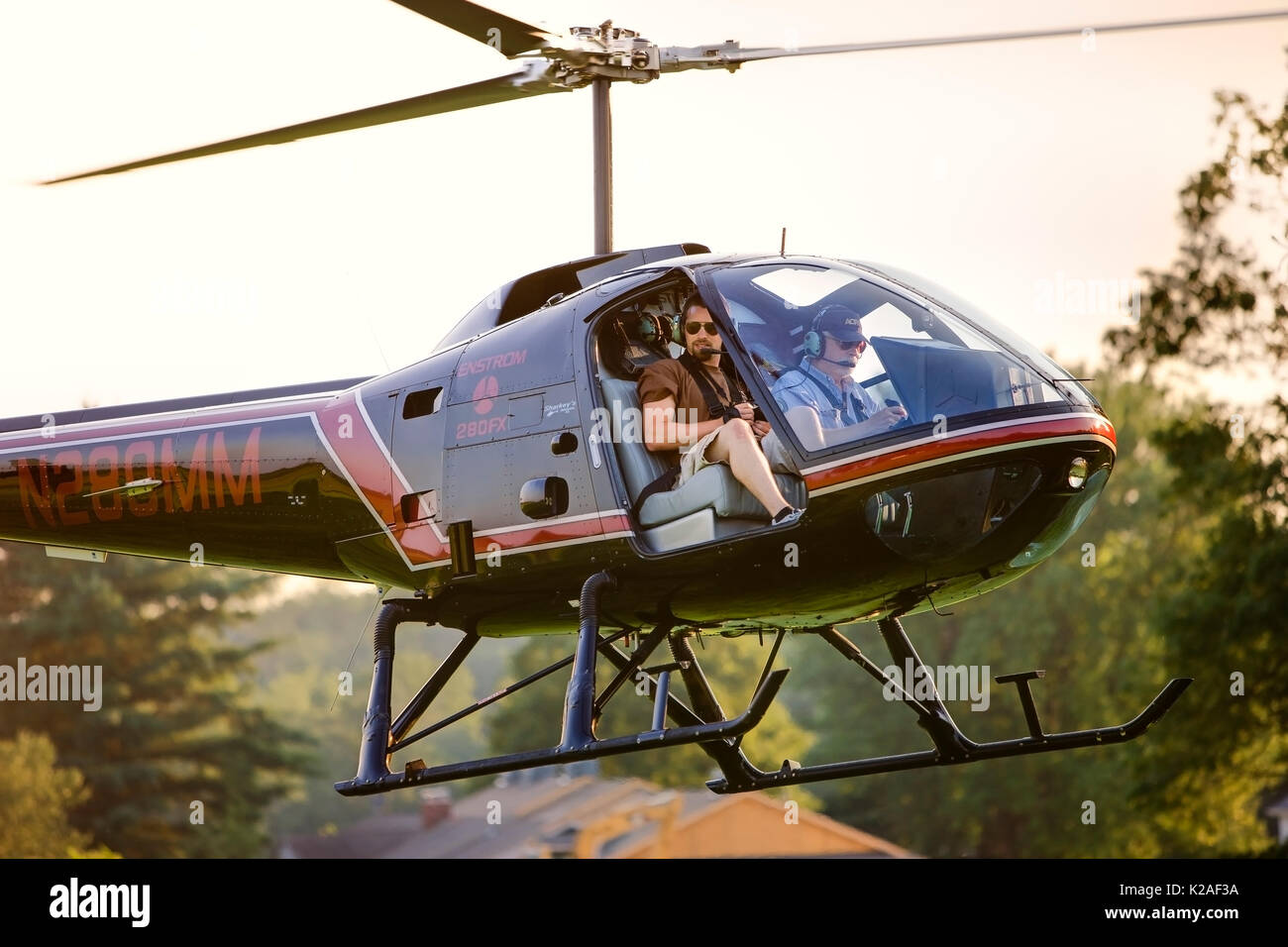 HELICOPTER TAKING OFF TO PERFORM AERIAL PHOTOGRAPHY, LANCASTER PENNSYLVANIA Stock Photo