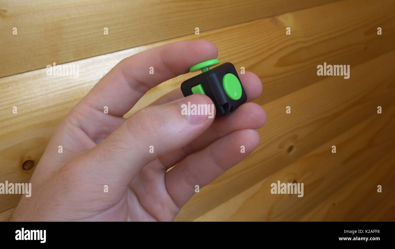 black and green fidget cube