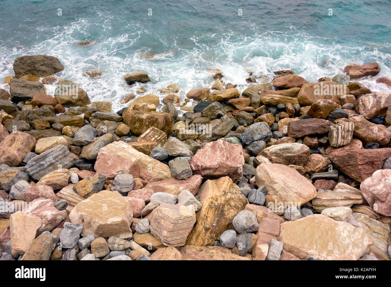 Marble and granite breakwater in Monterosso al Mare, Italy, 2017. Stock Photo