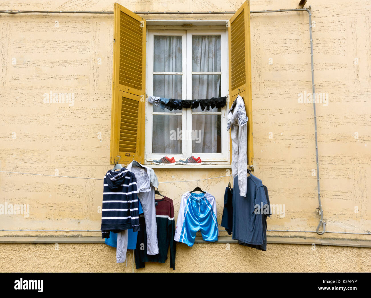 Window and laundry, Monterossa al Mare, Italy, 2017. Stock Photo