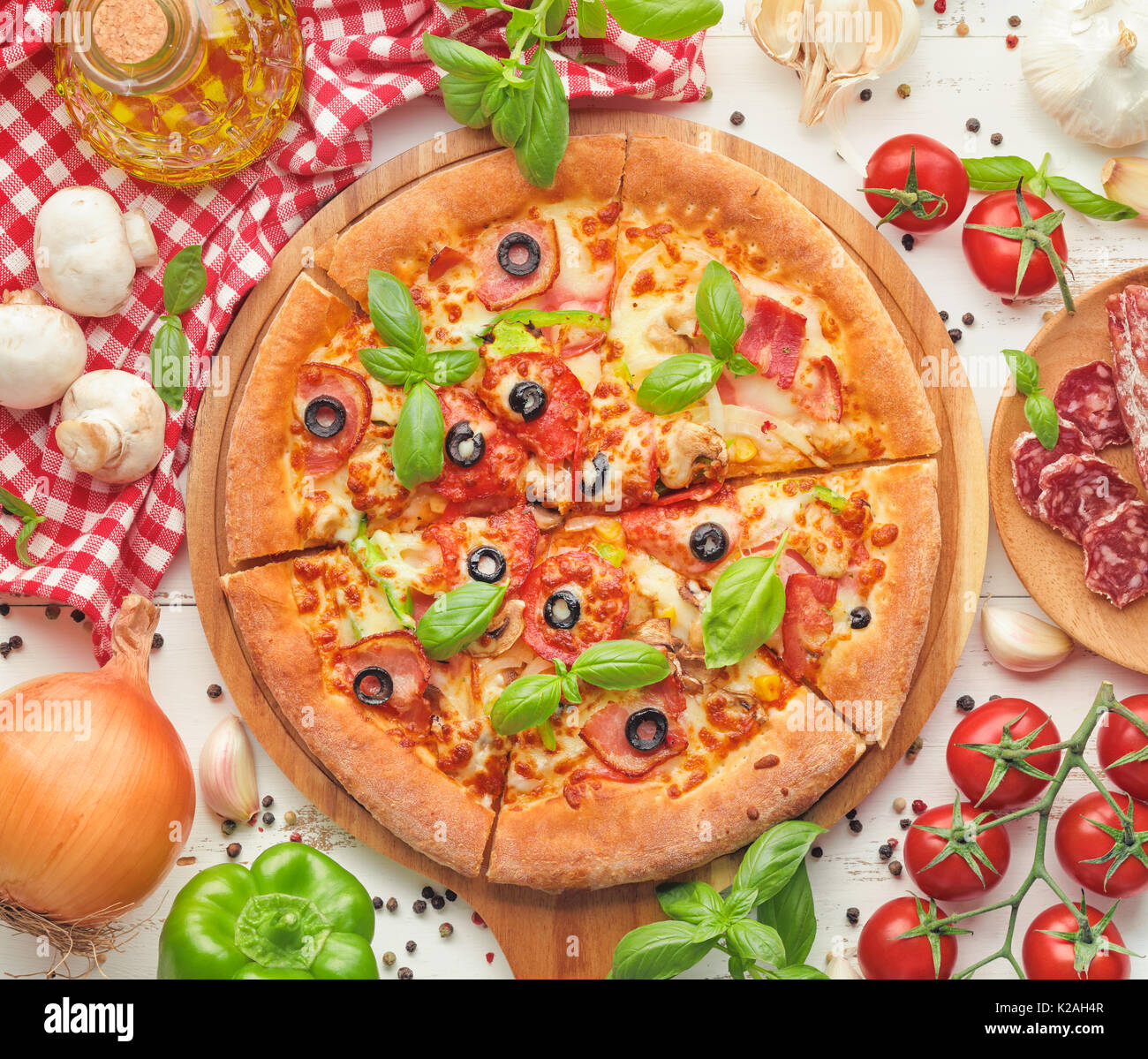 Delicious fresh pizza served on wooden table,top view. Stock Photo