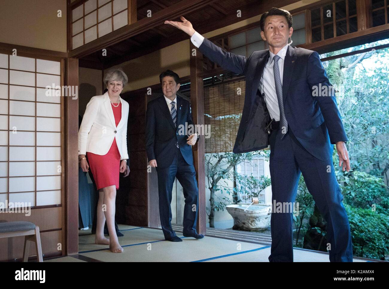 Prime Minister Theresa May during a visit to a Tea House in Kyoto with Prime Minister of Japan Shinzo Abe (centre), during her visit to the country. Stock Photo