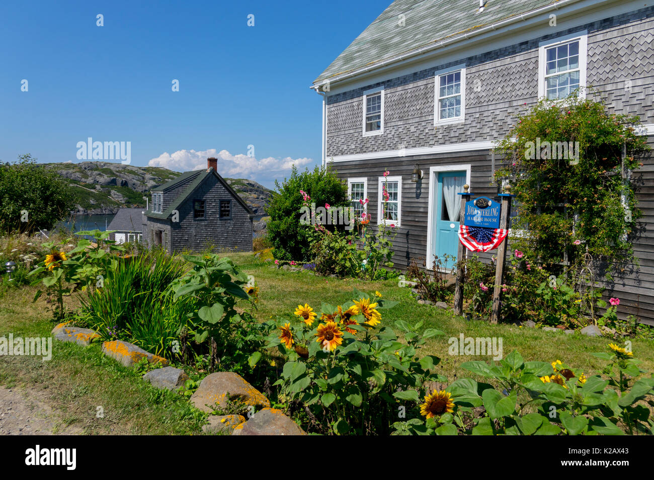 USA Maine ME Monhegan Island in Penobscot Bay in the Atlantic Ocean, an old home and garden Stock Photo
