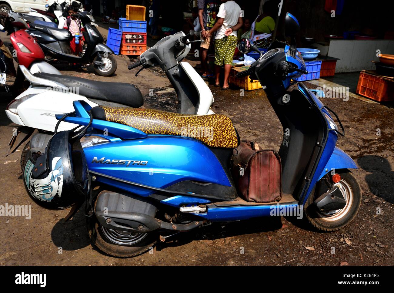 Leopard scooter seat on a Maestro moped parked outside the market in