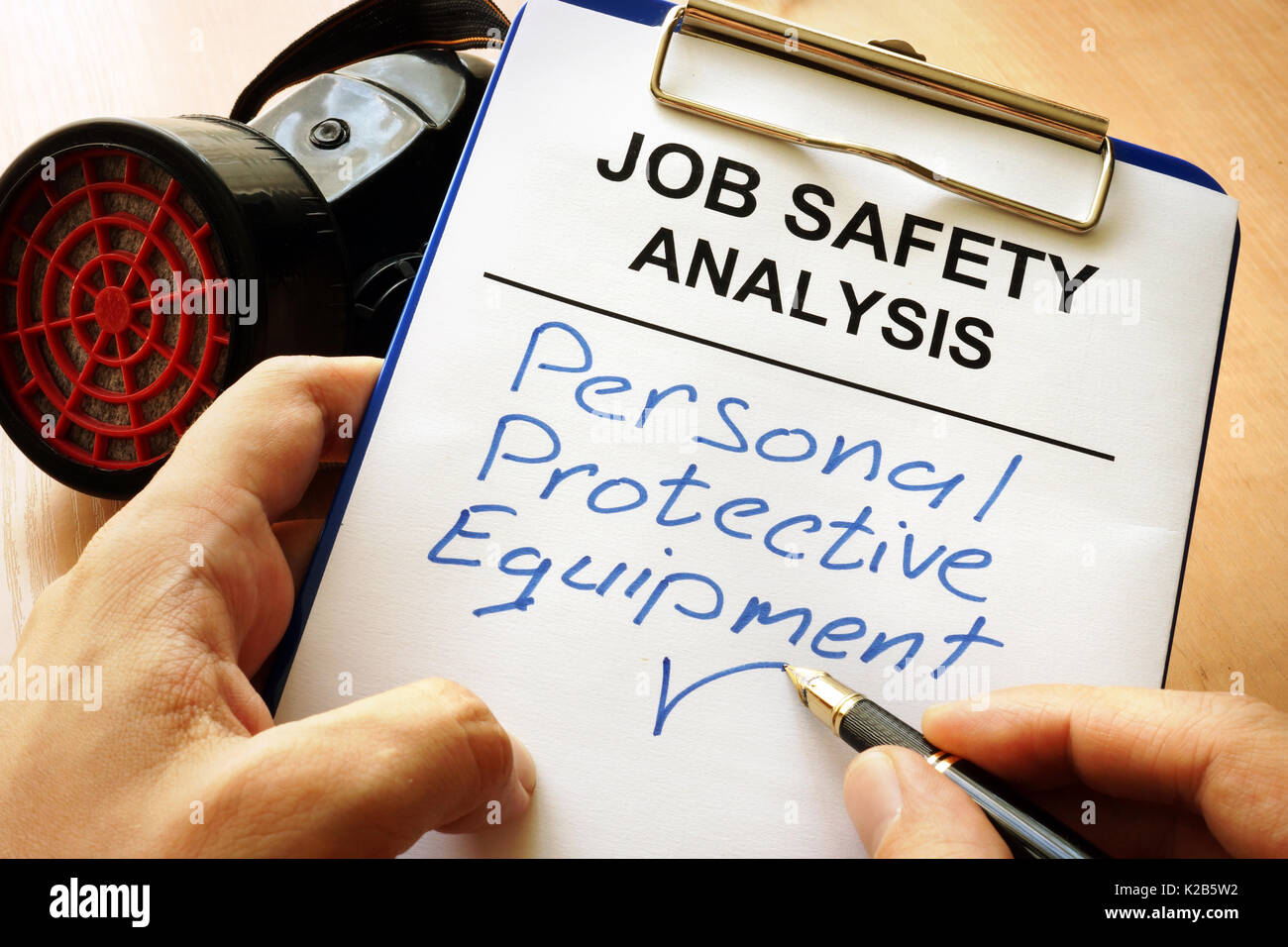 Man is writing words Personal protective equipment (PPE). Stock Photo