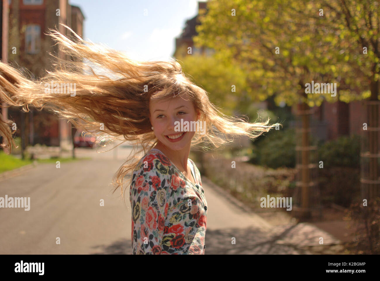 Young girl spinning round Stock Photo