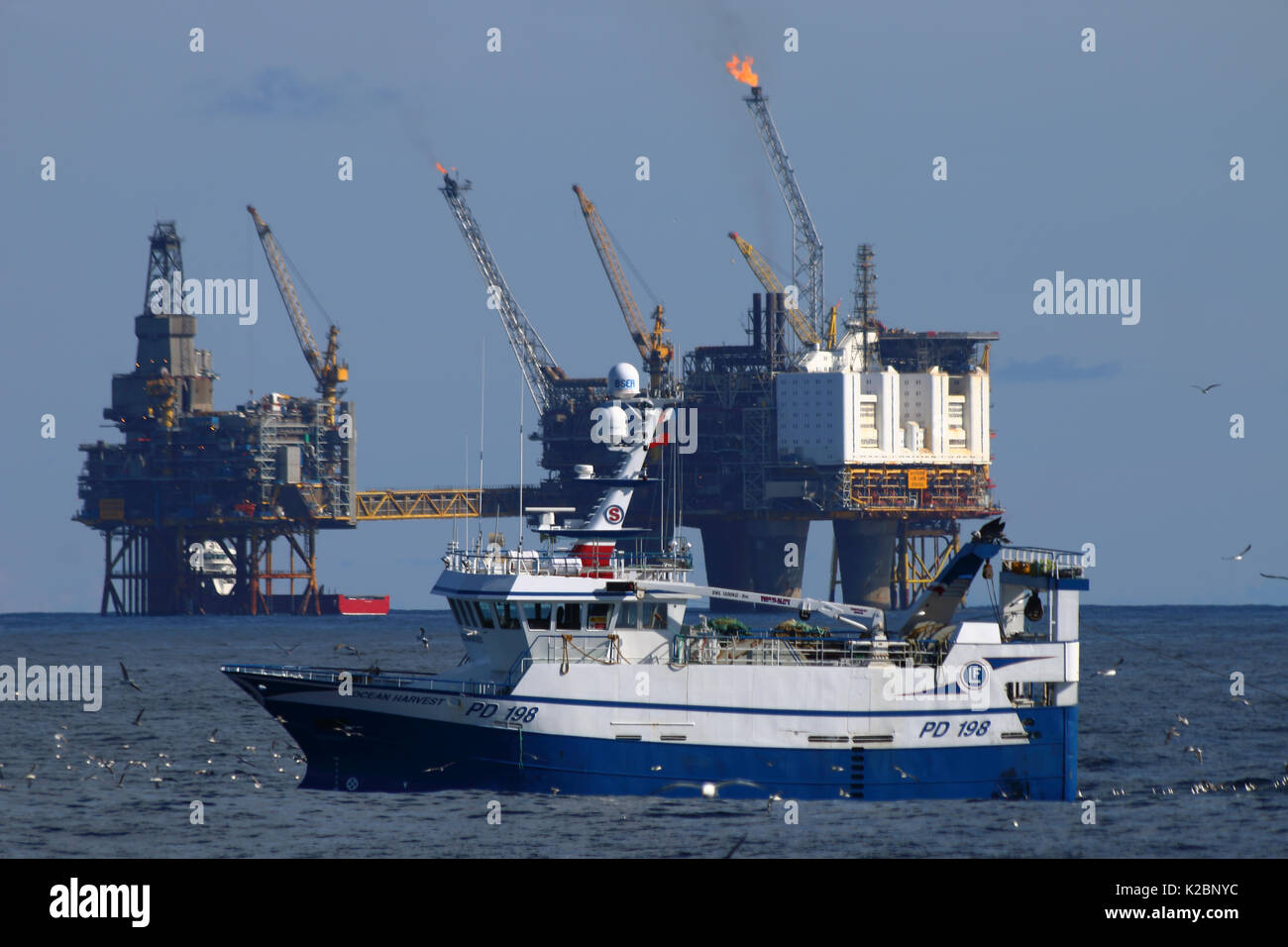 Fishing vessel 'Ocean Harvest' with the oseberg oilfield in background. April 2015. Stock Photo