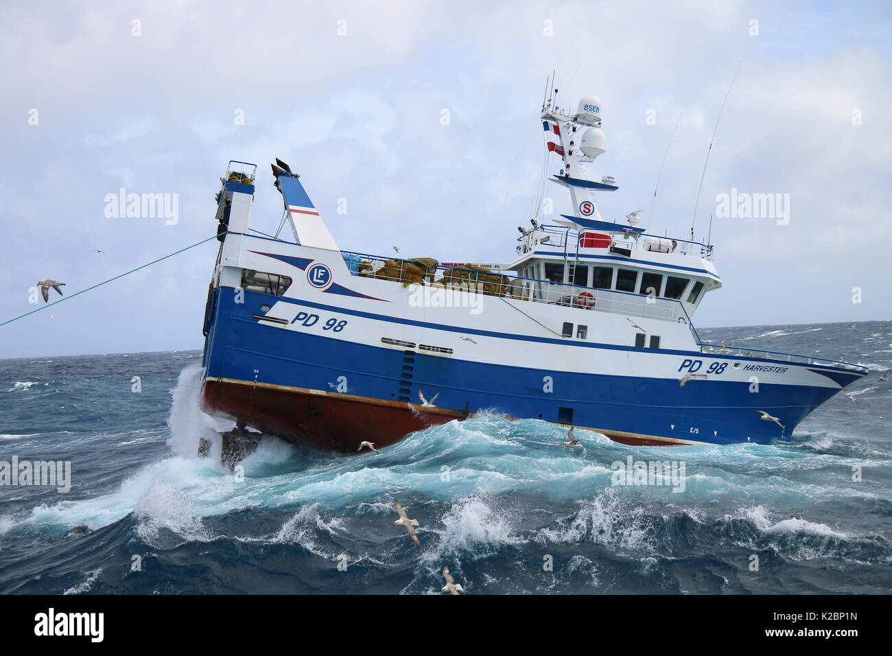 Fishing vessel 'Harvester' heaving up her trawl net. North Sea. July 2015.  Property released. Stock Photo