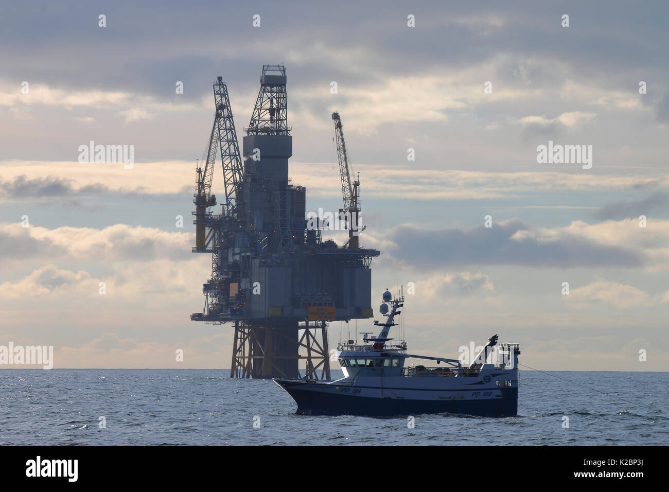Fishing vessel 'Ocean Harvest' trawling in close proximity to Oseberg Sor Platform, North Sea , May 2015. Stock Photo