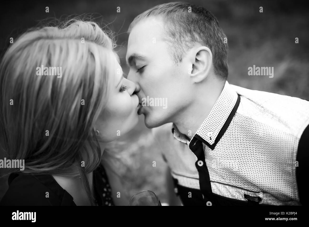 young teenagers on romantic date. beautiful girlfriend kissing and have a good time with boyfriend. happy family relationship concept Stock Photo