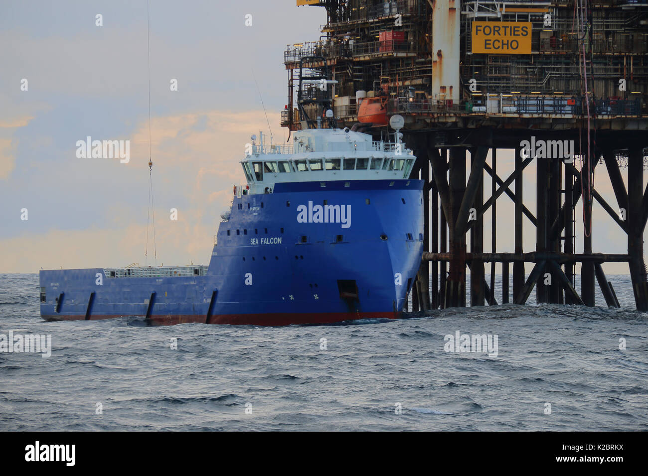 Supply vessel 'Sea Falcon' offloading cargo at the 'Forties Echo' platform, North Sea, October 2014.  All non-editorial uses must be cleared individually. Stock Photo