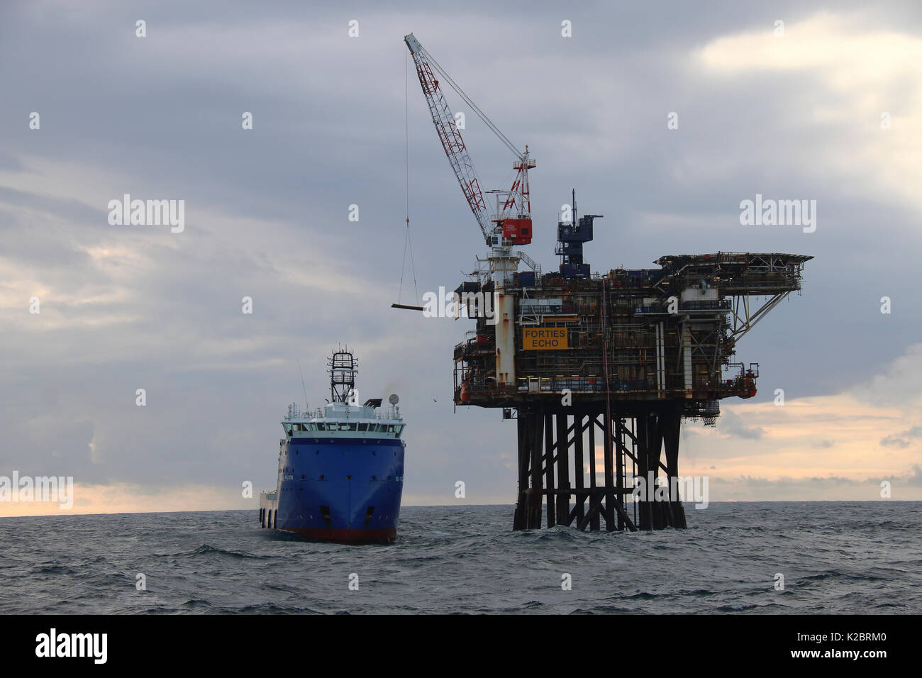 Supply vessel 'Sea Falcon' offloading cargo at the 'Forties Echo' platform, North Sea, October 2014.  All non-editorial uses must be cleared individually. Stock Photo