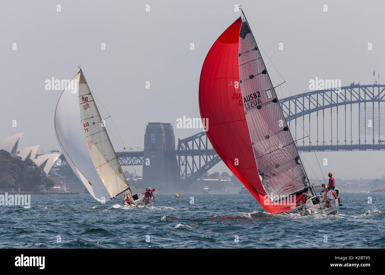 Sailboats with spinnakers out, racing in the Sydney Harbour, New South Wales, Australia, October 2012. All non-editorial uses must be cleared individually. Stock Photo