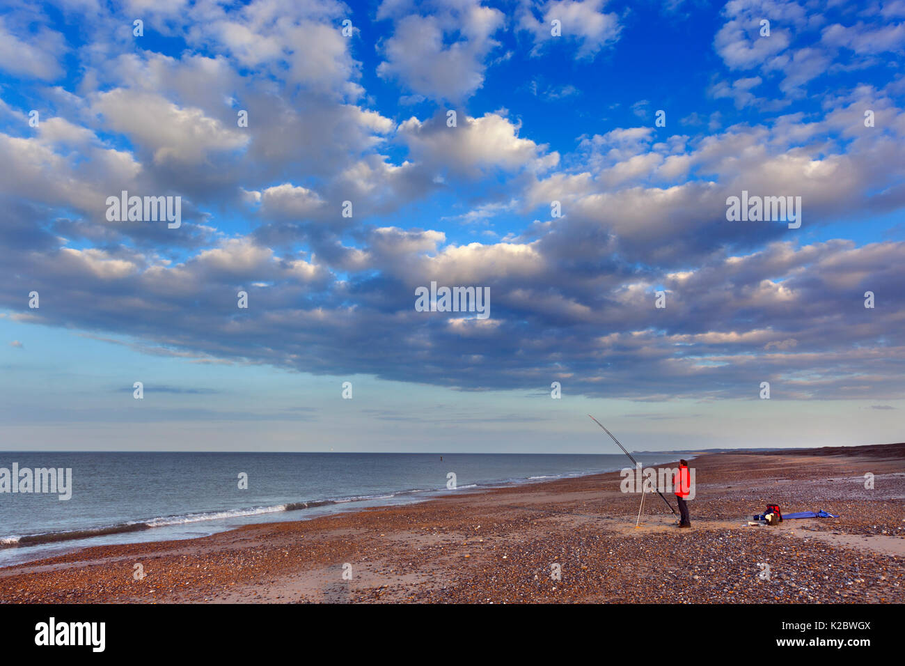 Angler fishing for Cod from Cley beach, Norfolk, England, UK September 2014. Stock Photo