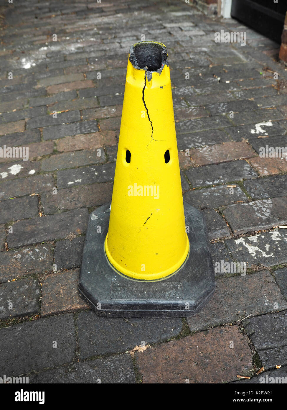 A yellow traffic cone that looks like a face Stock Photo