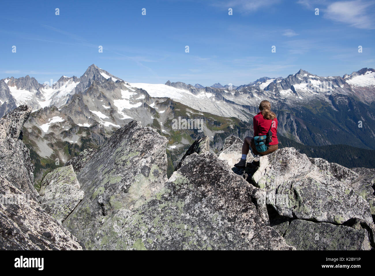 Woman looking out over the North Cascades National Park, Hidden Lakes Peaks. Washington , USA. Model released. Stock Photo