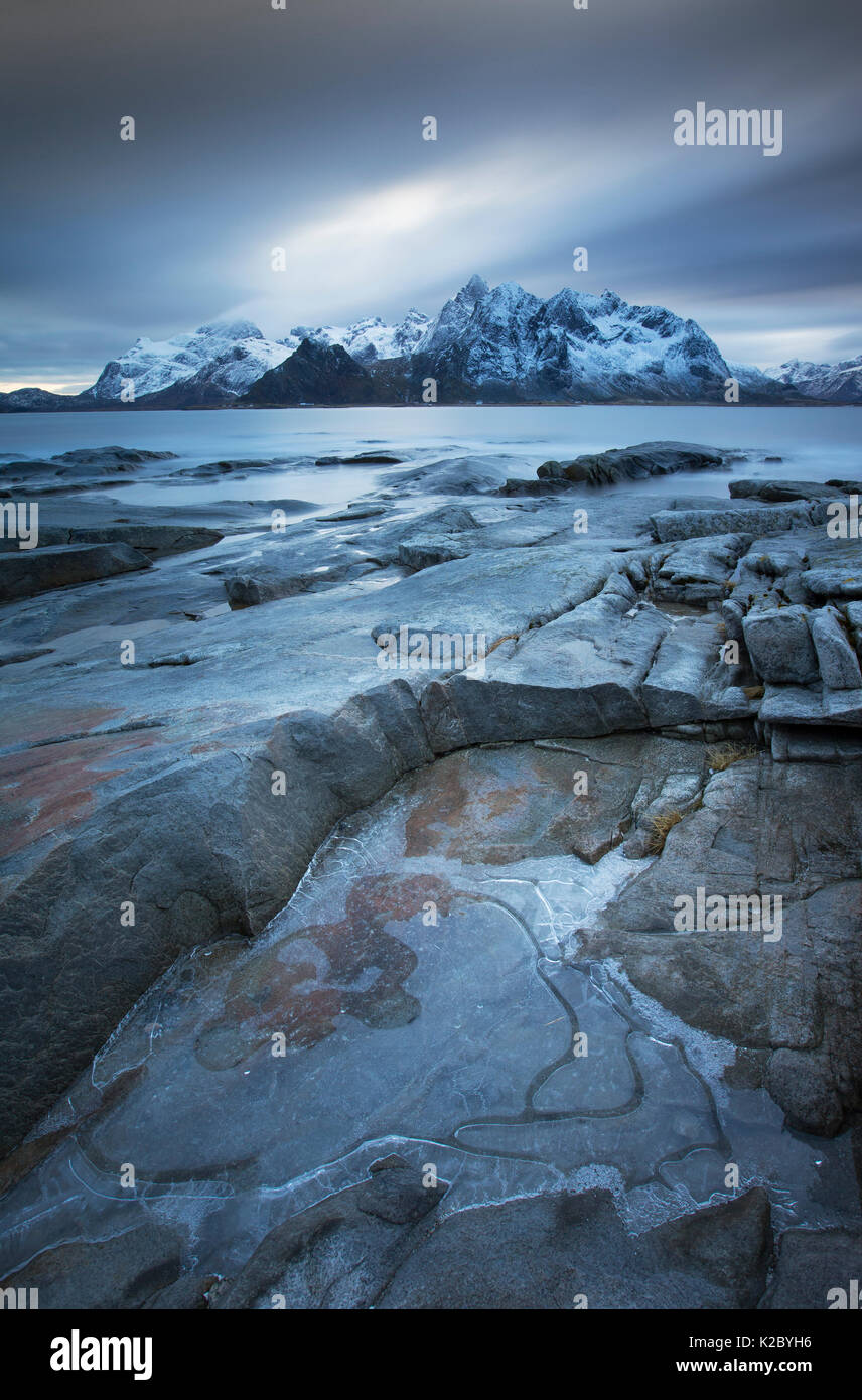 Rocky shoreline in winter overlooking Vareidsundet, Flakstadoya, Lofoten, Norway. February 2014. Stock Photo