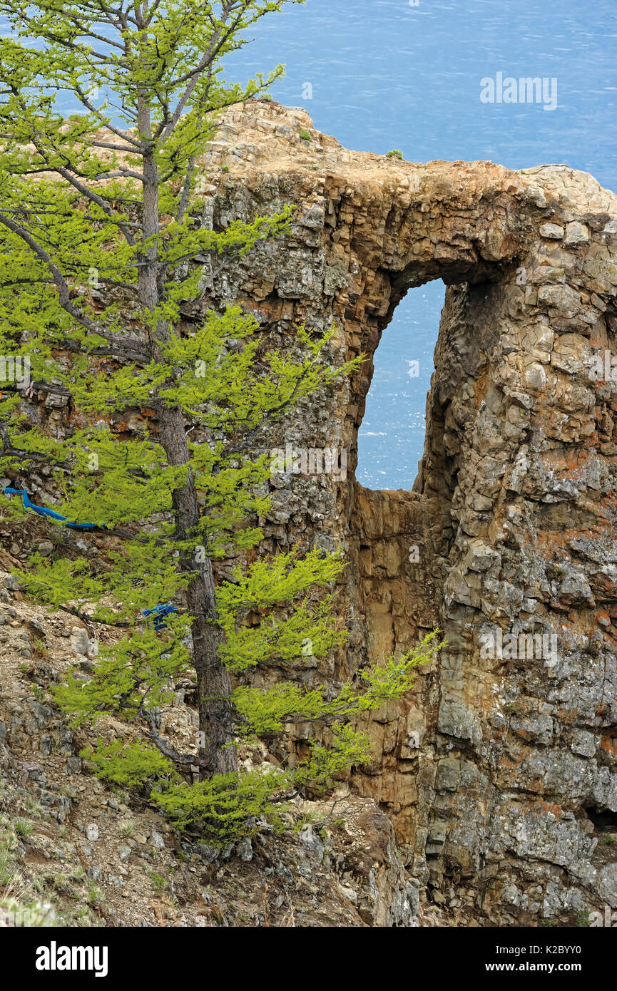 Cape Hoboy cliffs with eroded window, Olkhon island, Lake Baikal, Russia, June 2014. Stock Photo
