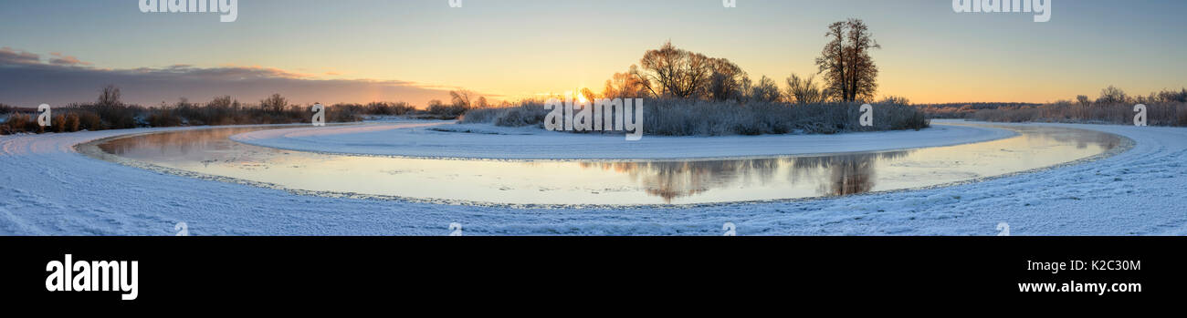 Panoramic view of river, mostly frozen in winter, Suur Emajogi, Tartumaa, Estonia, January 2014. Stock Photo