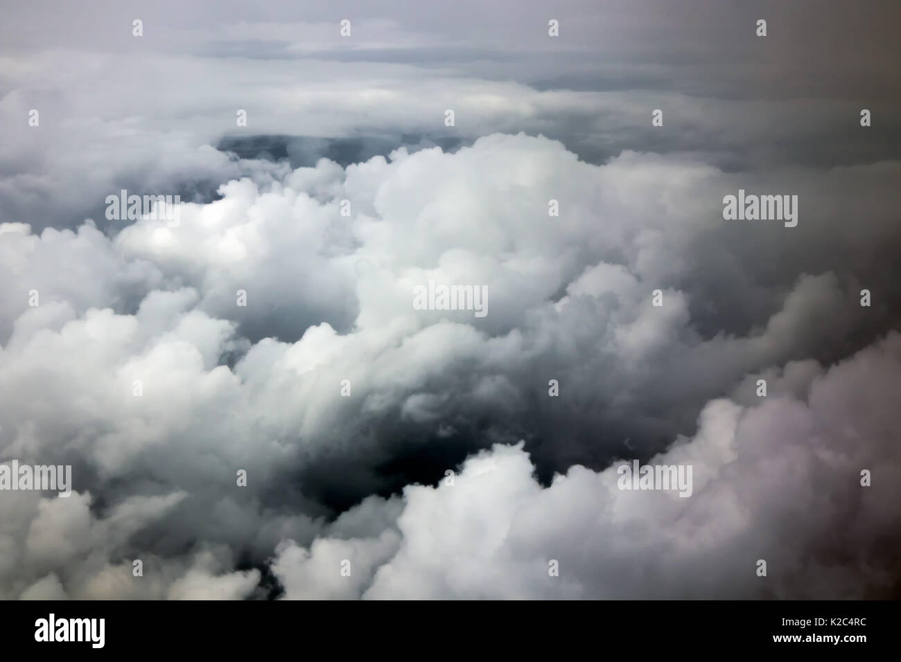 The dramatic sky with clouds made from a window of an airplane. Stock Photo