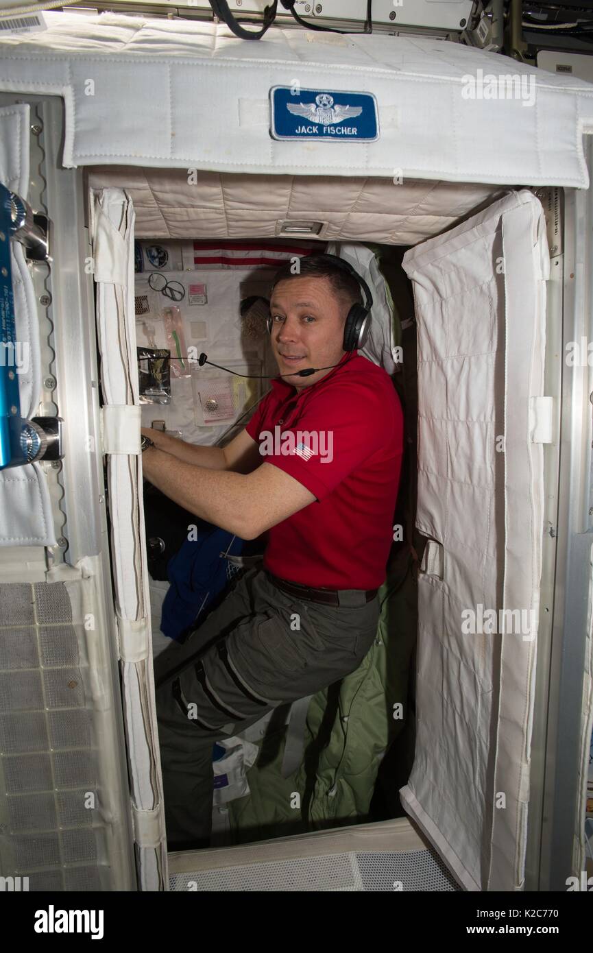 NASA International Space Station Expedition 51 prime crew member American astronaut Jack Fischer rests in a personal sleep station aboard the ISS May 1, 2017 in Earth orbit. Stock Photo