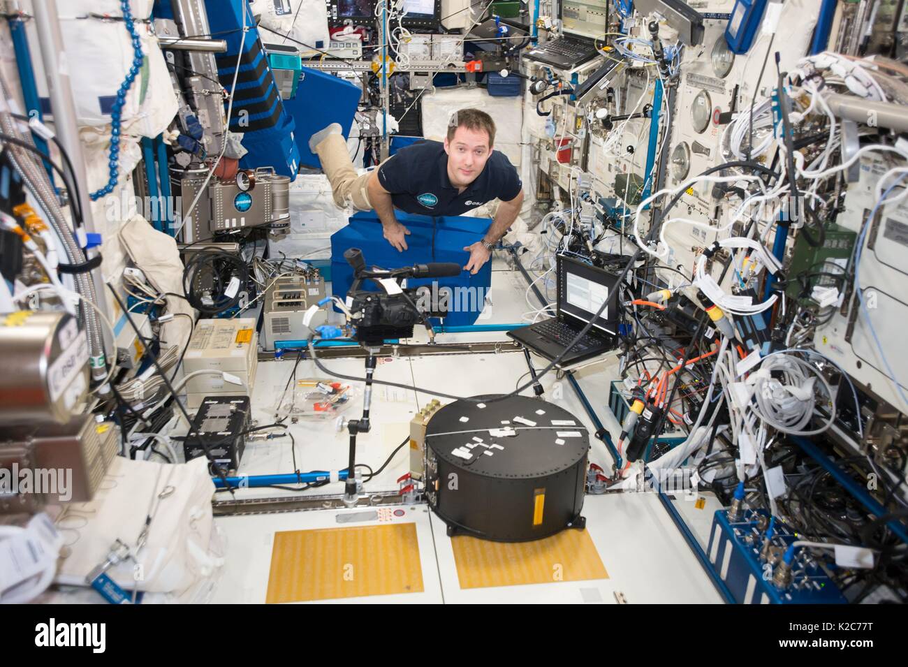 NASA International Space Station Expedition 51 prime crew member French astronaut Thomas Pesquet of the European Space Agency participates in a Fluidics experiment inside the Columbus Laboratory Module May 2, 2017 in Earth orbit. Stock Photo