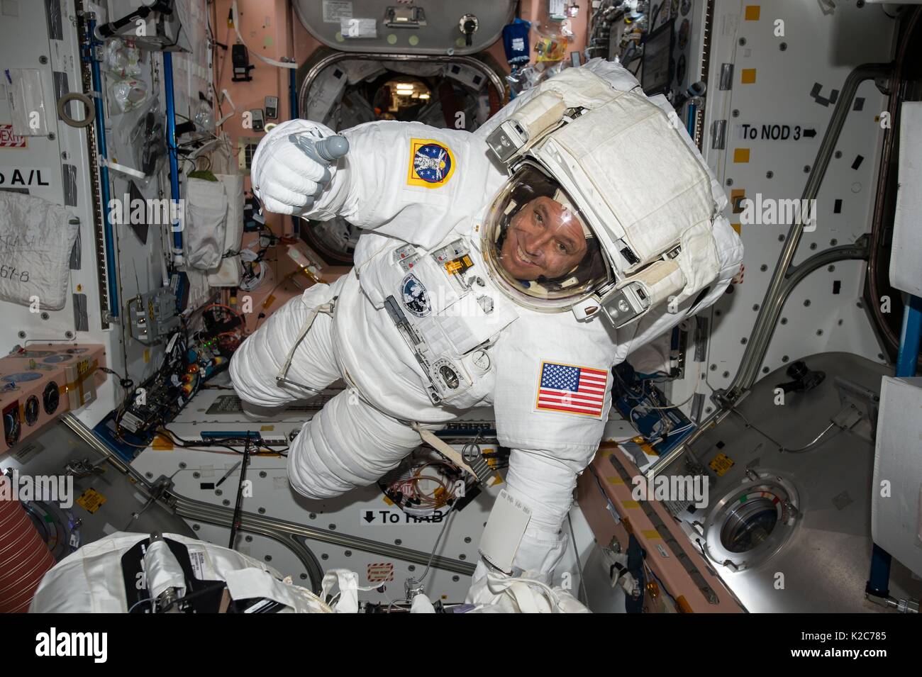 NASA International Space Station Expedition 51 prime crew member American astronaut Jack Fischer wears a spacesuit during a fit check in preparation for his first EVA spacewalk May 9, 2017 in Earth orbit. Stock Photo