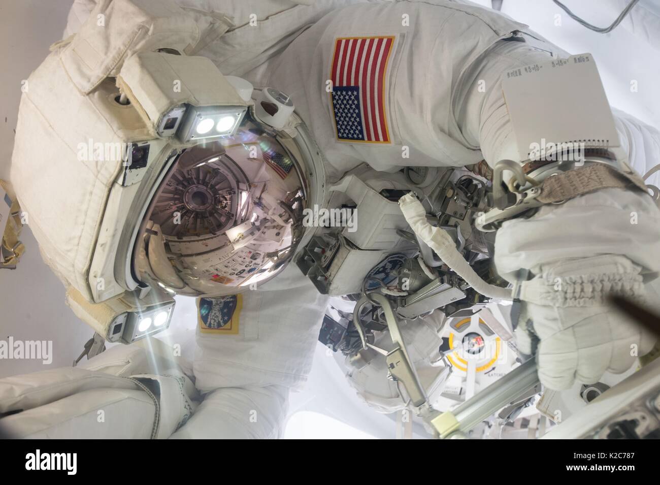 NASA International Space Station Expedition 51 prime crew member American astronaut Jack Fischer wears a spacesuit in the Quest airlock in preparation for an EVA spacewalk May 12, 2017 in Earth orbit. Stock Photo
