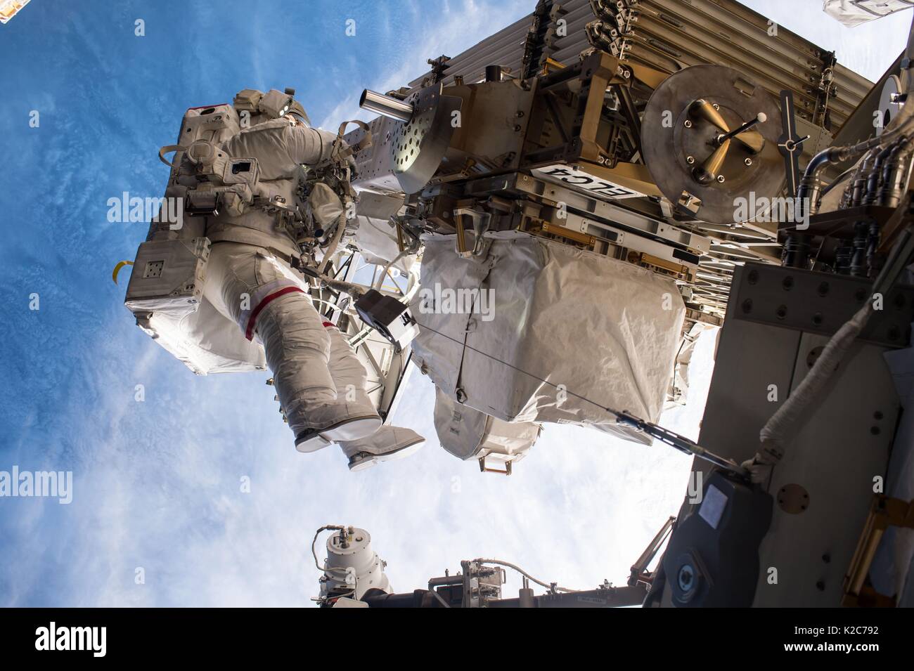 NASA International Space Station Expedition 51 prime crew member American astronaut Peggy Whitson works on the outside of the ISS during an EVA spacewalk May 12, 2017 in Earth orbit. Stock Photo