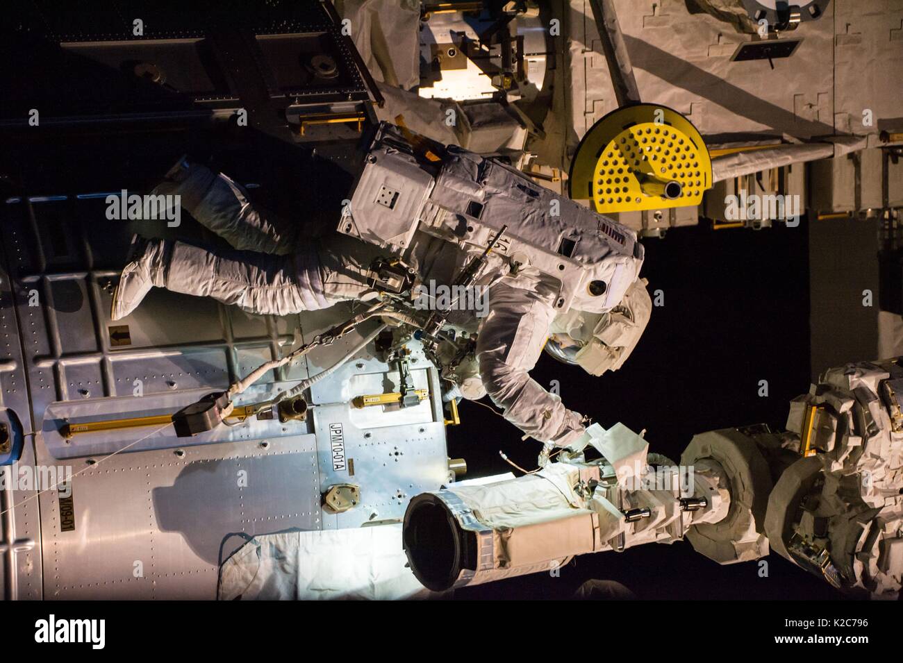 NASA International Space Station Expedition 51 prime crew member American astronaut Jack Fischer works on the outside of the ISS Japanese Kibo Laboratory module during an EVA spacewalk May 12, 2017 in Earth orbit. Stock Photo
