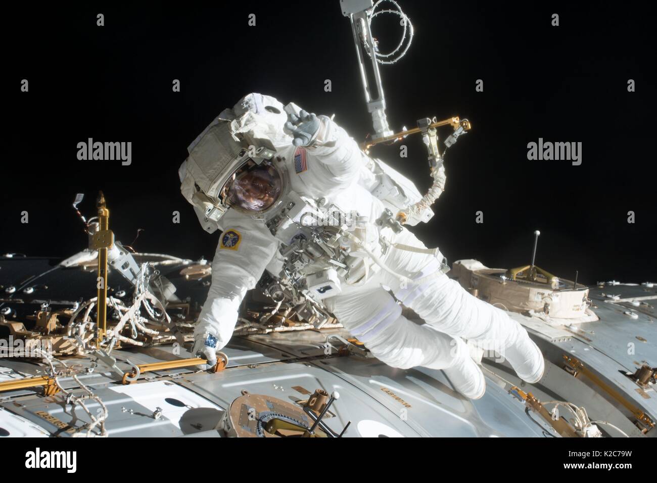 NASA International Space Station Expedition 51 prime crew member American astronaut Jack Fischer works on the outside of the ISS U.S. Destiny laboratory module during an EVA spacewalk May 23, 2017 in Earth orbit. Stock Photo