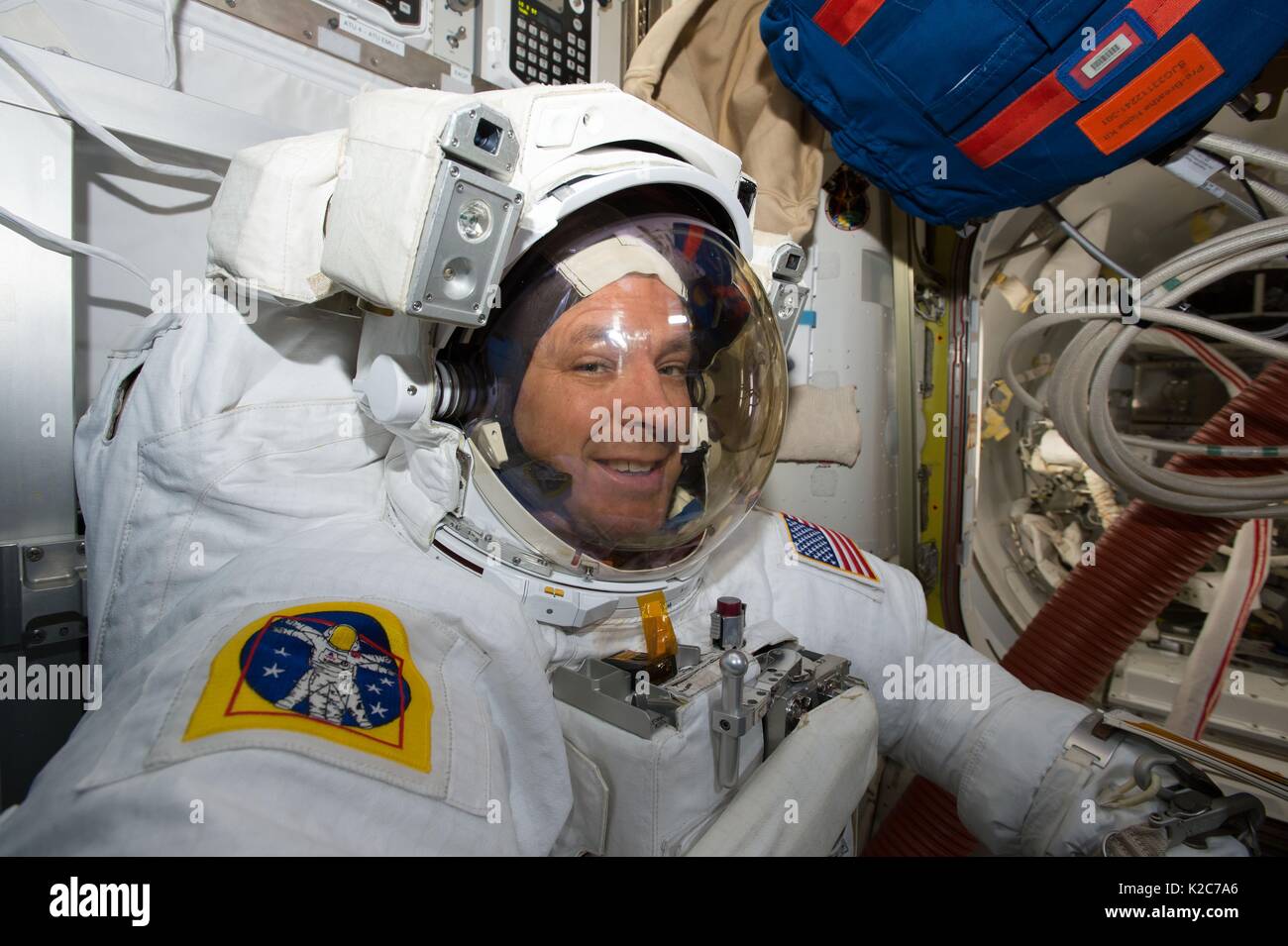 NASA International Space Station Expedition 51 prime crew member American astronaut Jack Fischer suits up in a spacesuit in preparation for an EVA spacewalk in the ISS Quest airlock May 23, 2017 in Earth orbit. Stock Photo