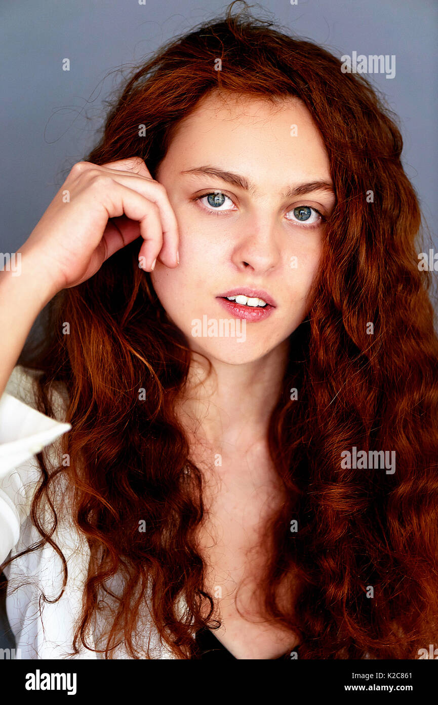 Model Tests Beautiful Redhead Girl With Curly Hair