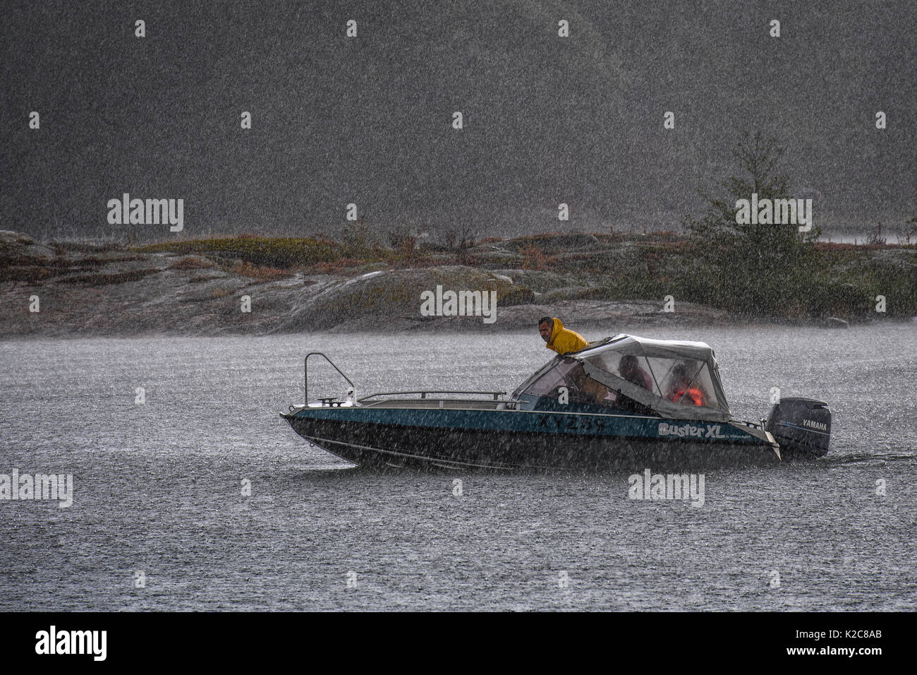 Powerboat in rainstorm Stock Photo