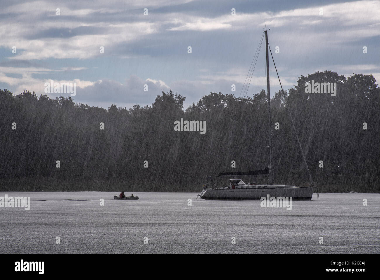 Sailing boat in rainstorm Stock Photo