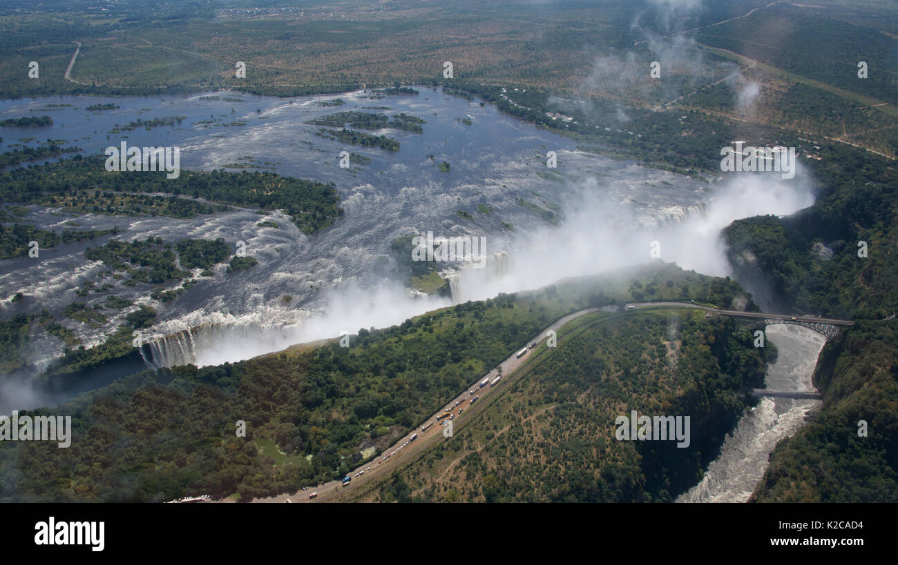 Panoramic aerial view Victoria Falls in full force and Victoria Falls Bridge Zambia/Zimbabwe Stock Photo