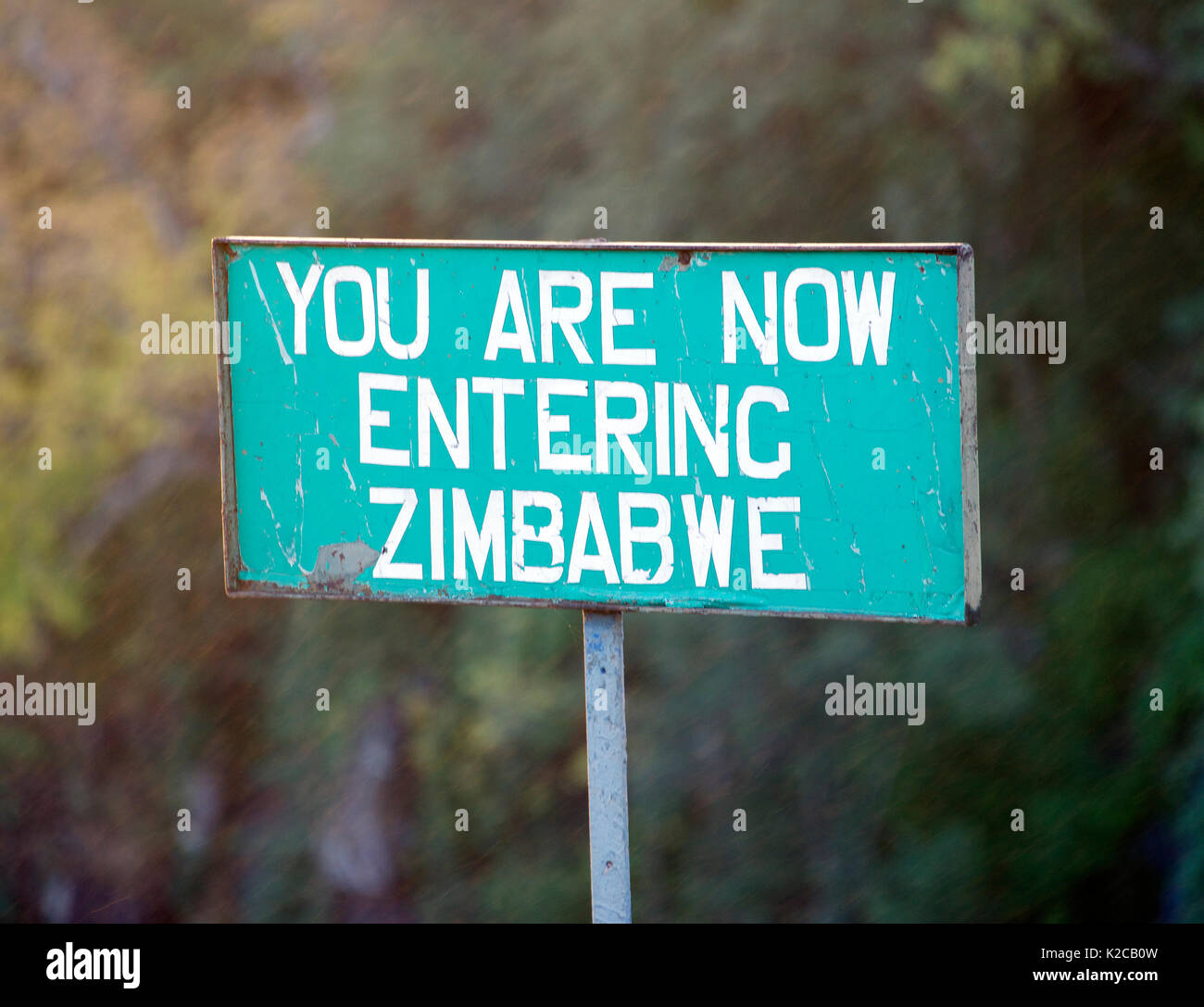 Sign post YOU ARE NOW ENTERING ZIMBABWE Victoria Falls Bridge Zimbabwe Stock Photo
