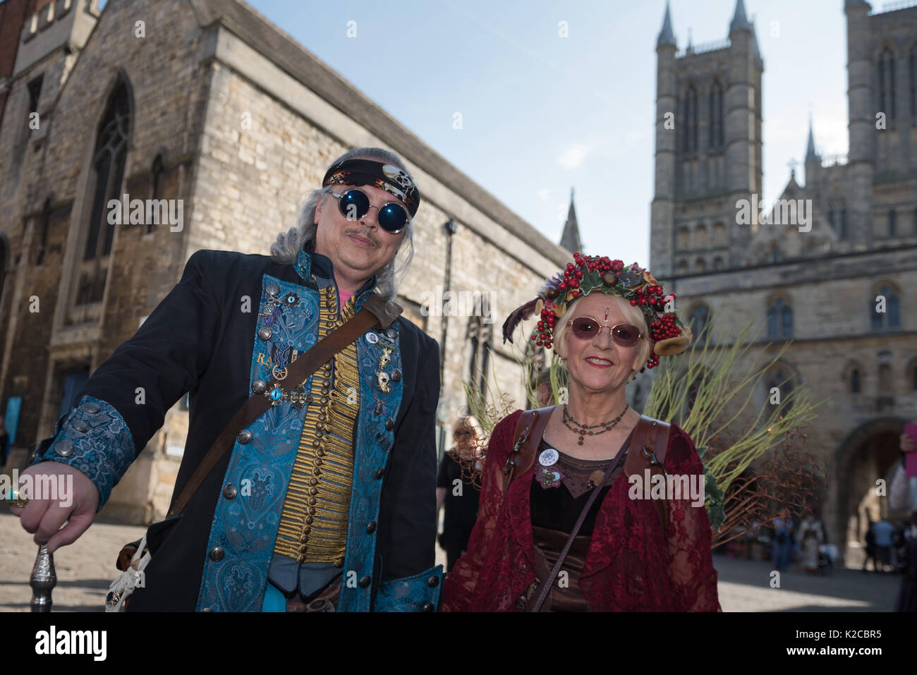 Lincoln, Lincolnshire, UK. 26th August 2017. Pictured:  A couple make the best of the sunny weather attired in their steampunk costumes. /  Thousands  Stock Photo
