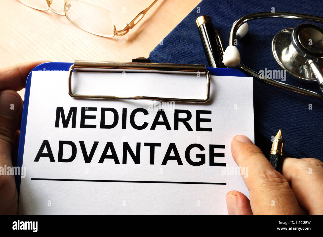 Medicare advantage in a clipboard. Health care insurance concept. Stock Photo